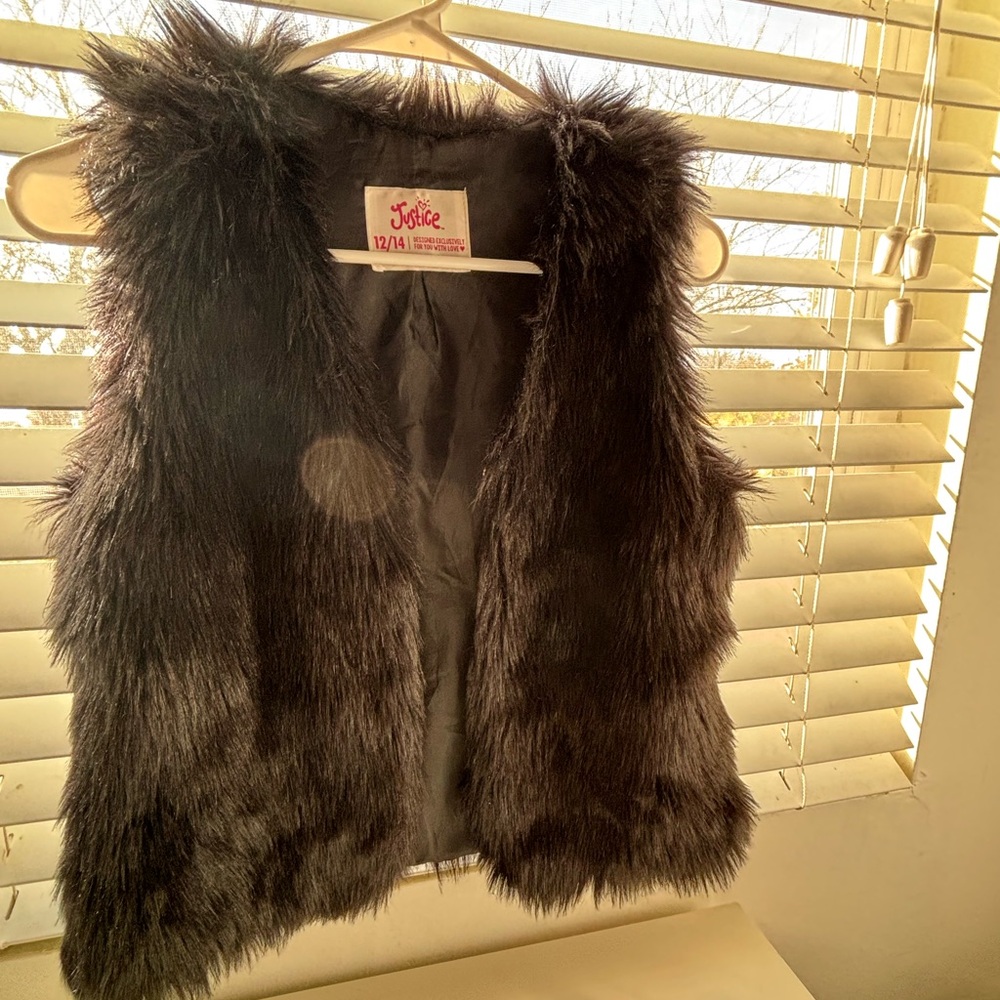 A black furry vest for kids